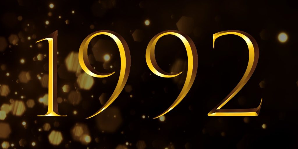 Gold numbers "1992" on a dark background with subtle golden sparkles, representing the Olivier Winners of that year.