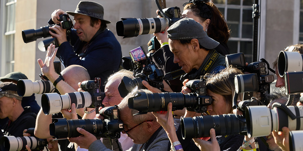 Photographers on the green carpet at the Olivier Awards 2025.