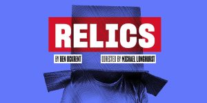 A collection of ancient relics displayed on a wooden shelf, featuring intricate designs and various textures.